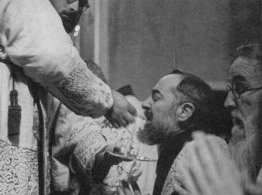 Padre Pio Receiving Communion